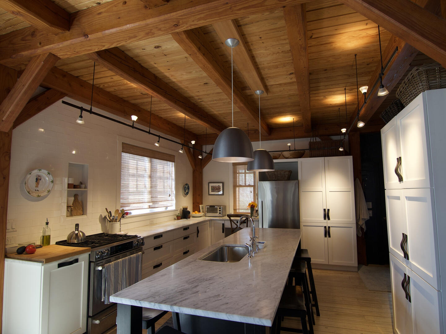 Timberframe Home - A New England timberframe farmhouse, modernized with layered LED lighting in an open floor plan.
