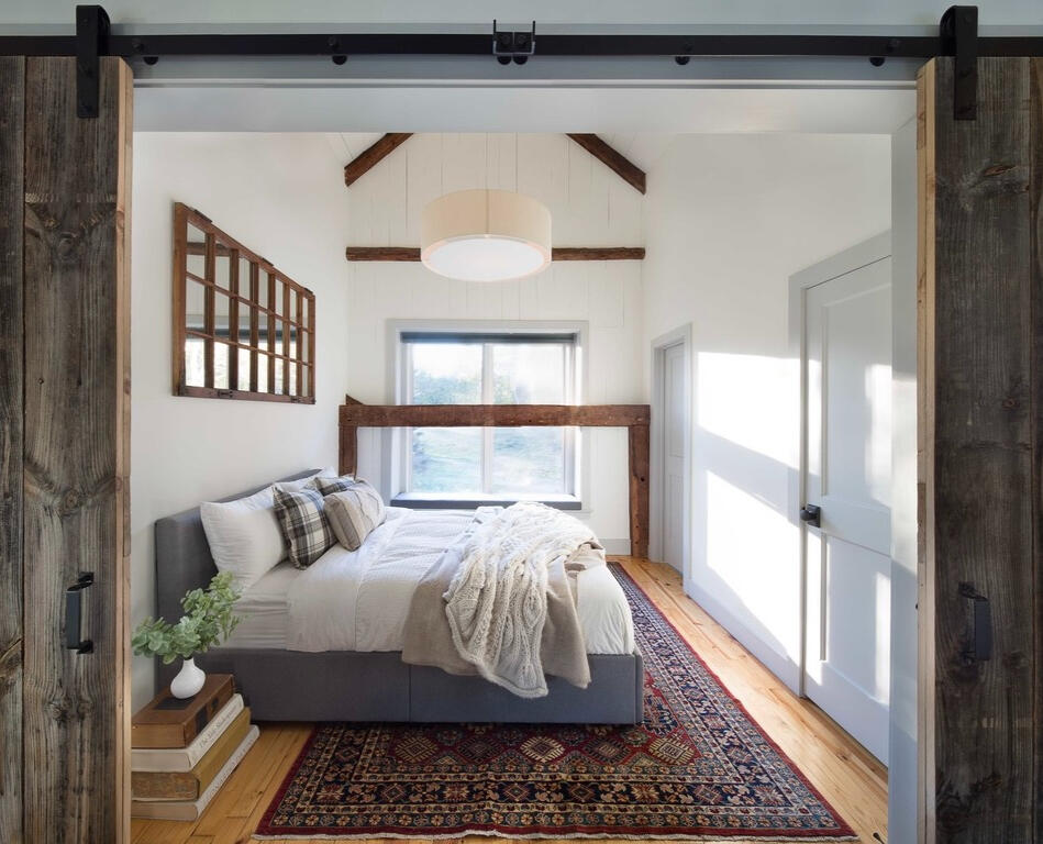 Old Barn Conversion - Original barn timbers appear throughout, including here in the bedroom.