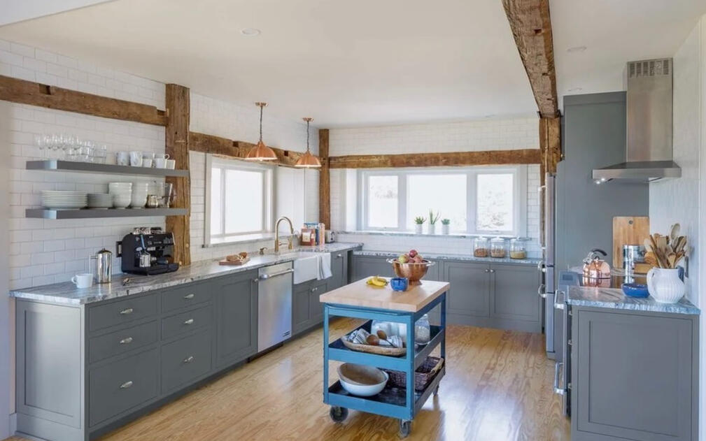 The kitchen includes a pass-thru awning window to the 3 season porch.