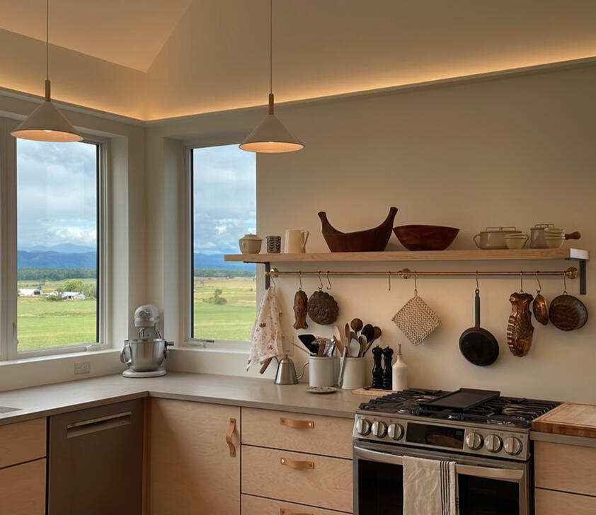 LED tapes in flat coves throughout. Also under-shelf lighting for tasks.